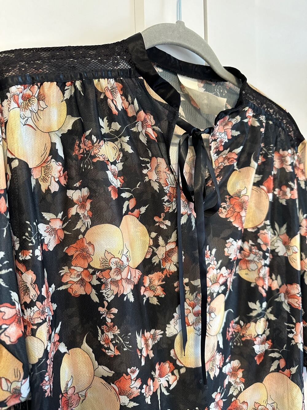 92. Vintage blouse with bow; sheer; size large